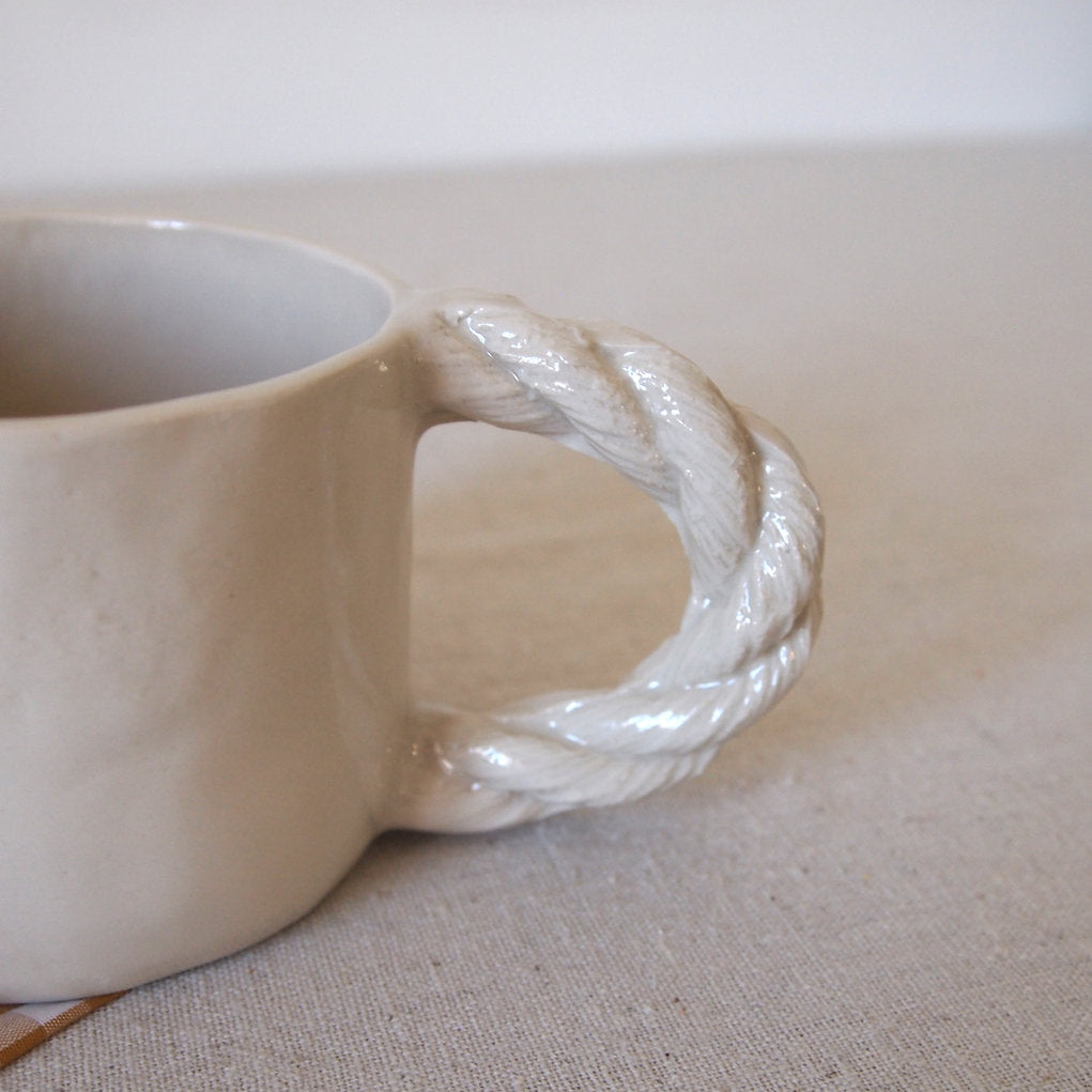 Small cup with rope handle