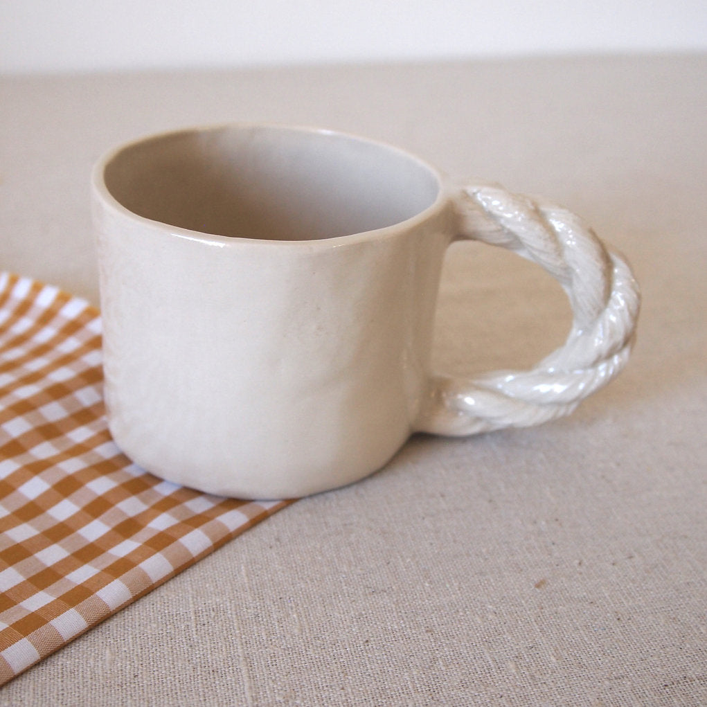 Small cup with rope handle