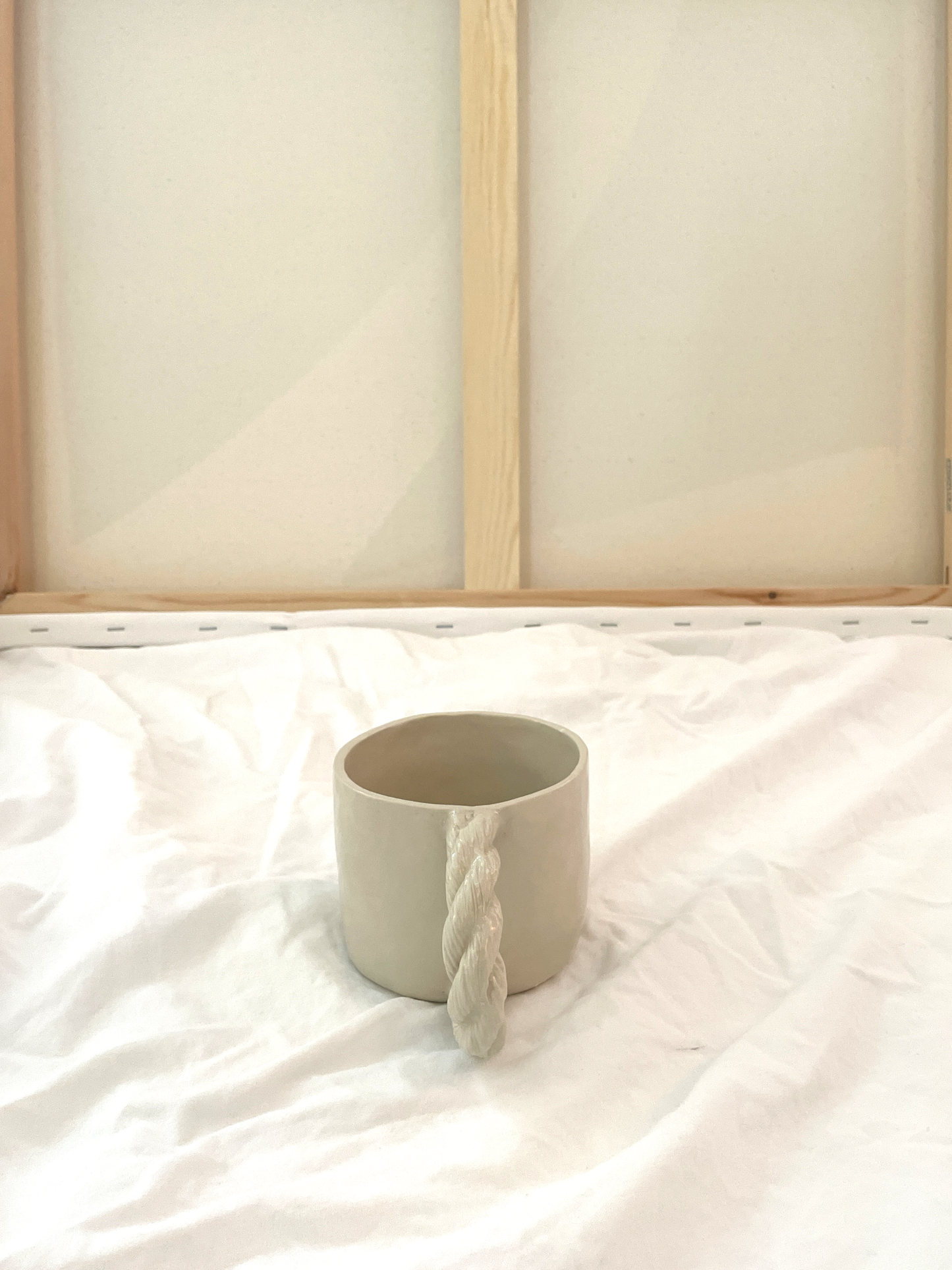 Small cup with rope handle