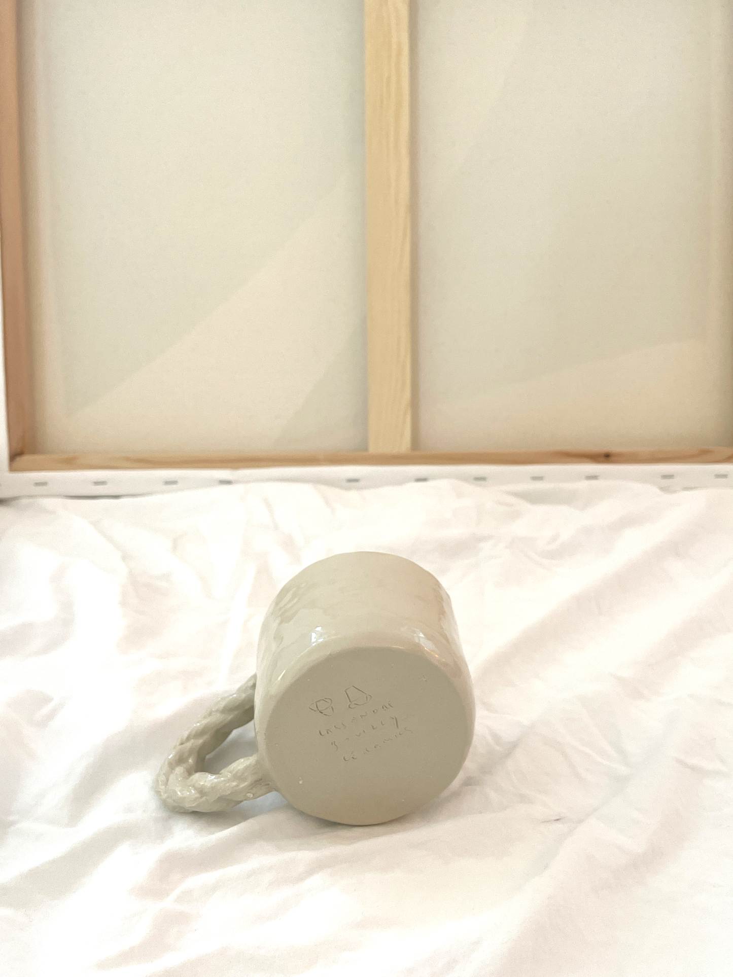 Small cup with rope handle