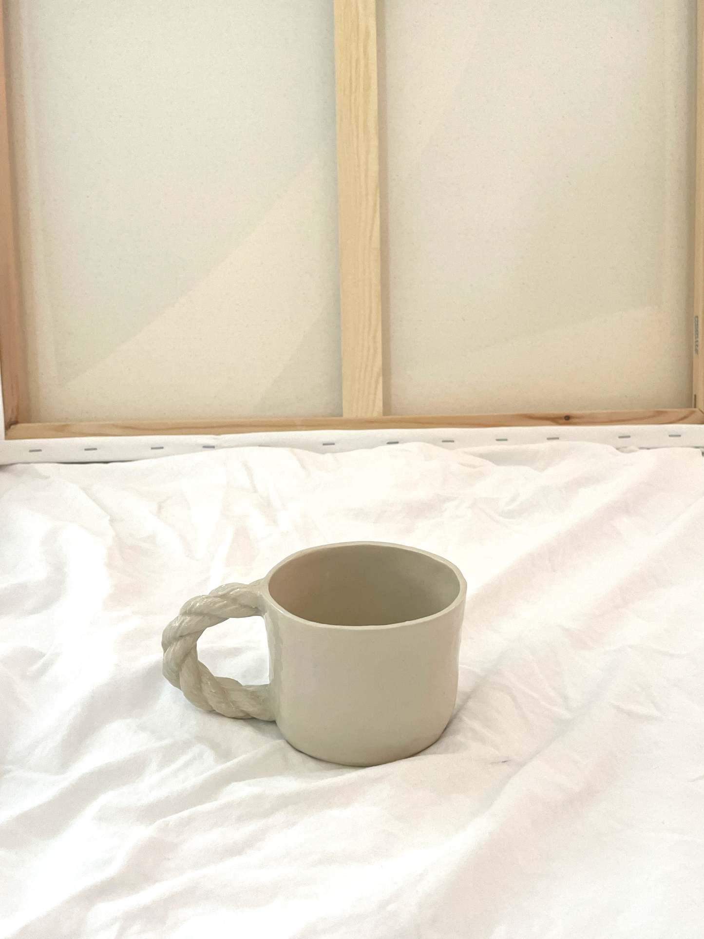 Small cup with rope handle