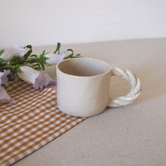 Small cup with rope handle